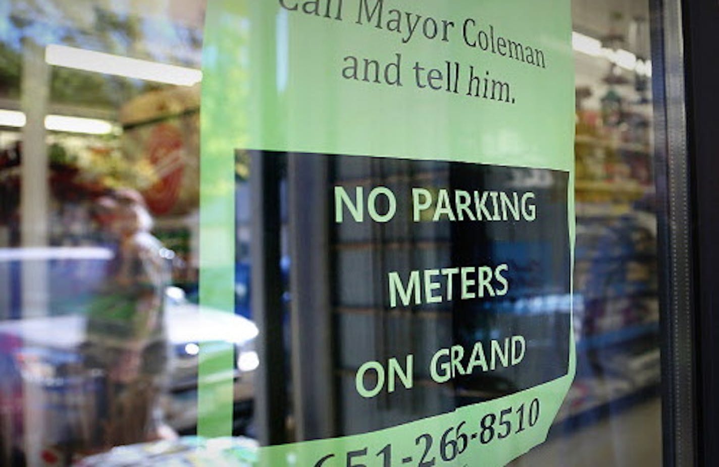 A customer walked into Frattelone Ace Hardware passed a sign that asked for support of no parking meters along Grand Avenue in St. Paul.