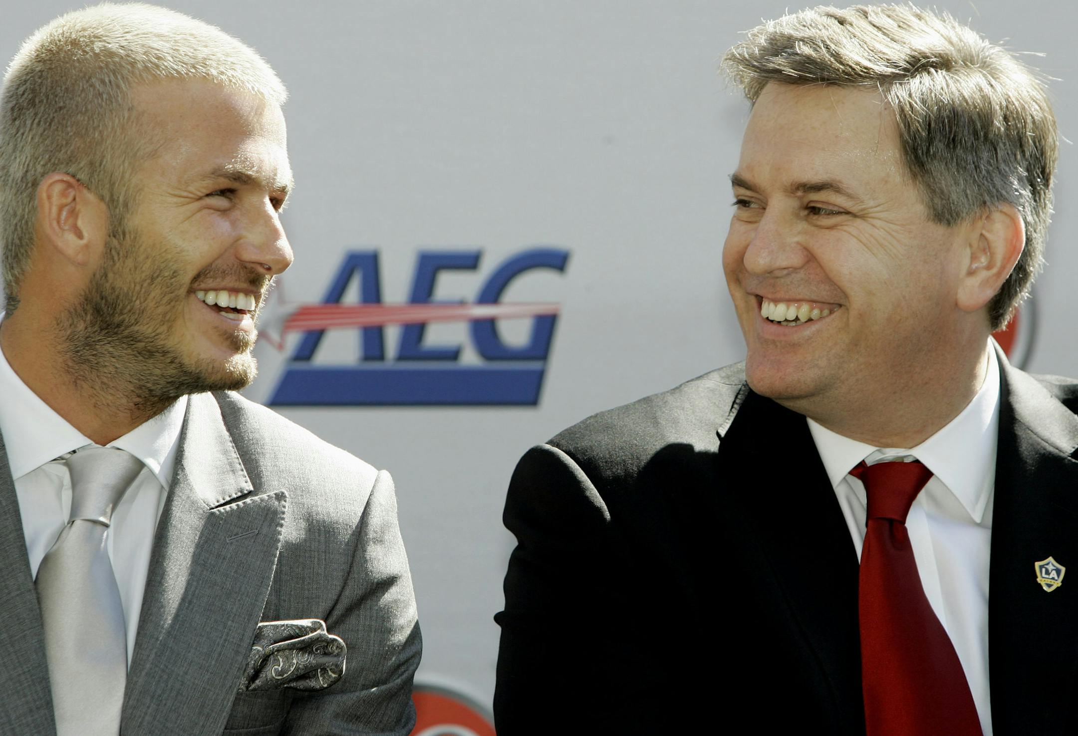 England soccer player David Beckham, left, talks to Anschutz Entertainment Group President and CEO Timothy J. Leiweke during a news conference to introduce Beckham as the newest member of the Los Angeles Galaxy soccer team, Friday, Feb. 13, 2007, in Carson, Calif. (AP Photo/Nick Ut) ORG XMIT: CATG119