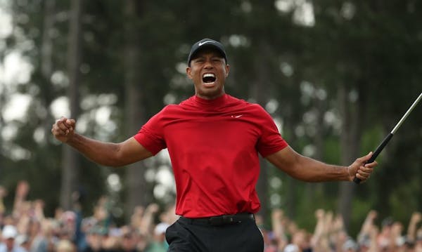 After tapping in for bogey on the 18th green for a one-stroke victory, Tiger Woods let the emotions flow Sunday at Augusta National.