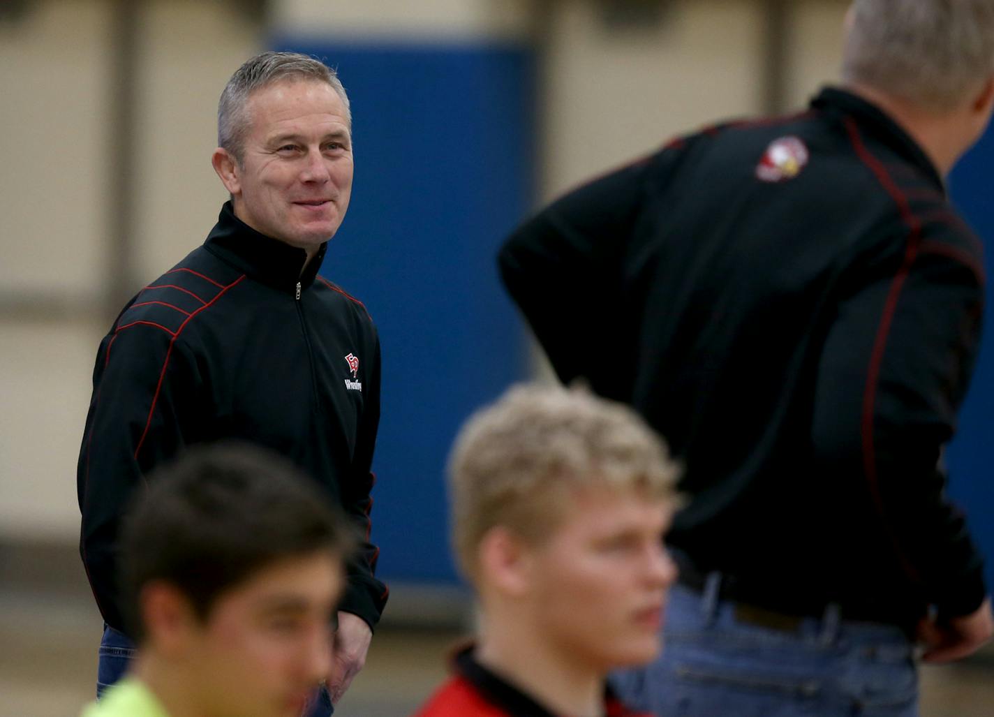 Eden Prairie's assistant coach Jim Jackson smiled back at head coach Scot Davis during a meet. ] (KYNDELL HARKNESS/STAR TRIBUNE) kyndell.harkness@startribune.com Triangle meet Wayzata vs Edina vs Eden Prairie in Plymouth Min., Thursday, January 8, 2014.