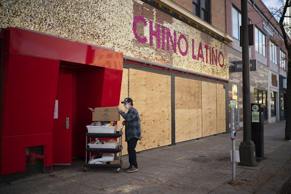 A worker removed supplies from Hennepin Avenue's Chino Latino, which closed this week after a 20-year run.