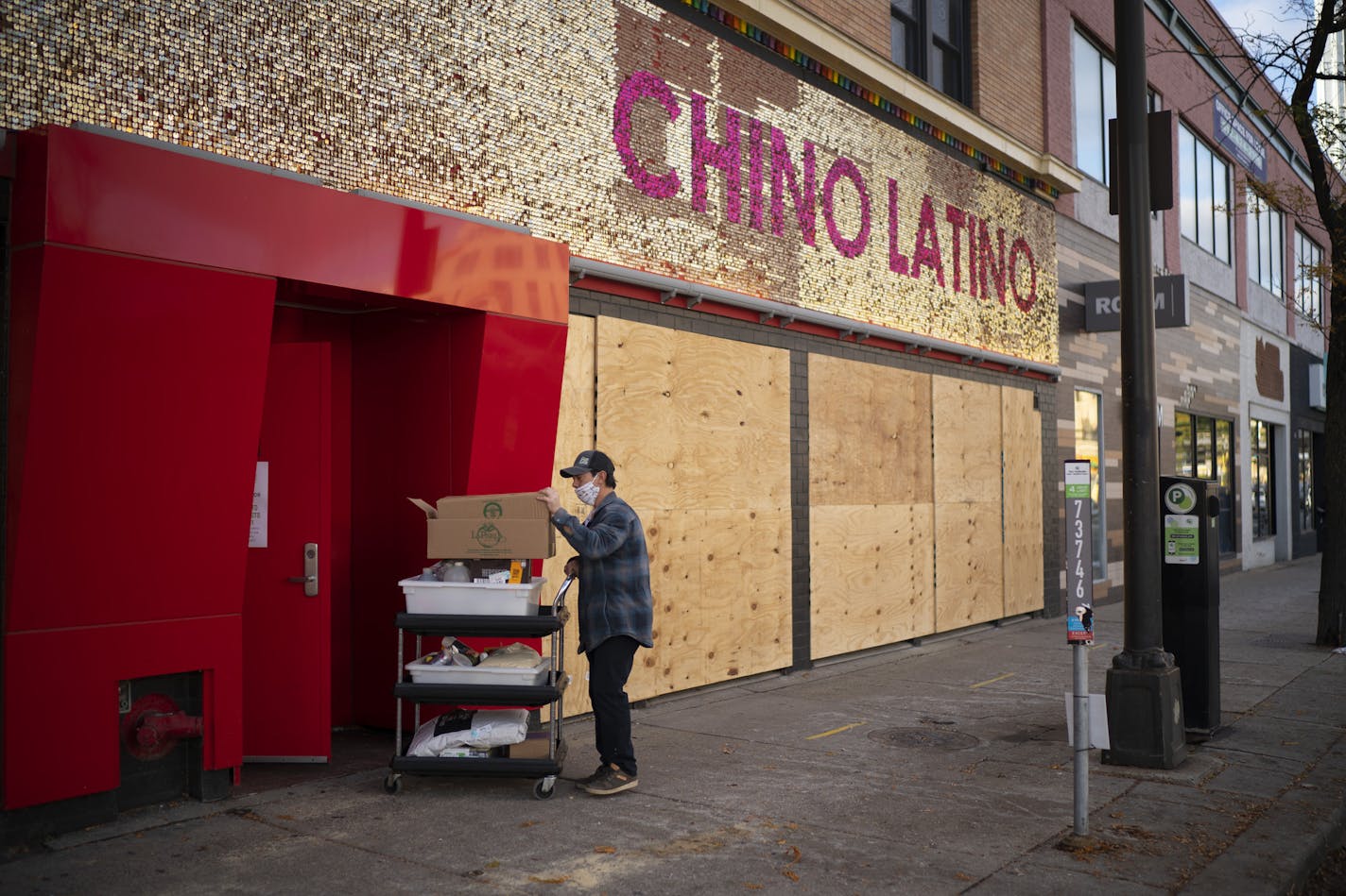 A worker removed supplies from Hennepin Avenue's Chino Latino, which closed this week after a 20-year run.