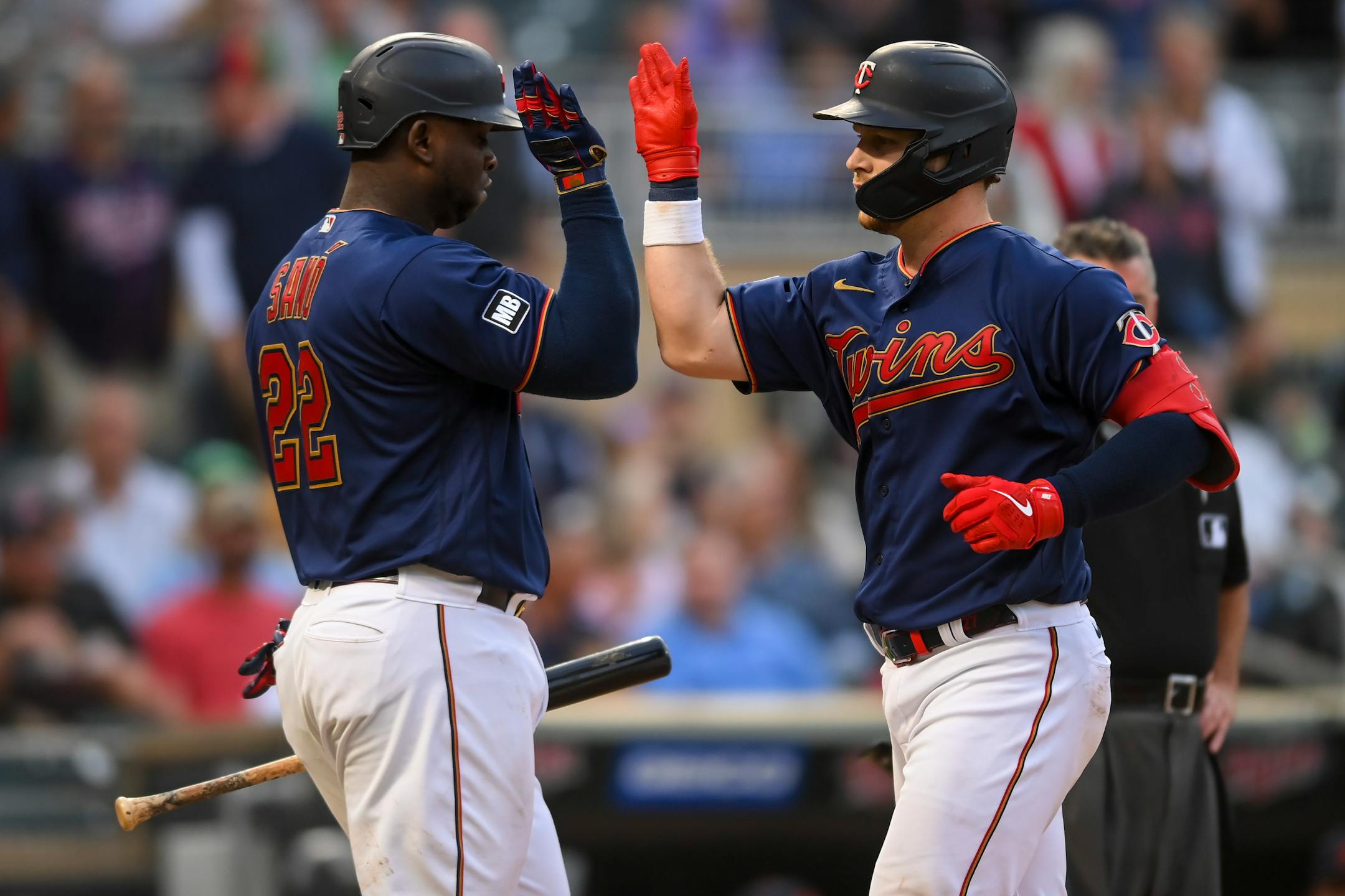 Minnesota Twins catcher Ryan Jeffers (27) and first baseman Miguel Sano (22) celebrated a fifth inning home run by Jeffers against the Detroit Tigers.