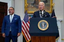 President Joe Biden speaks beside Education Secretary Miguel Cardona at the White House on June 30. Last year, the U.S. Supreme Court foiled Biden's p