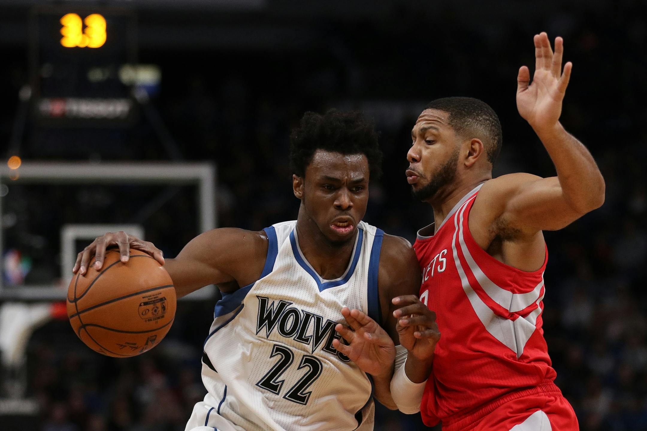 Minnesota Timberwolves forward Andrew Wiggins (22) drives the ball around Houston Rockets guard Eric Gordon (10) in the first half.