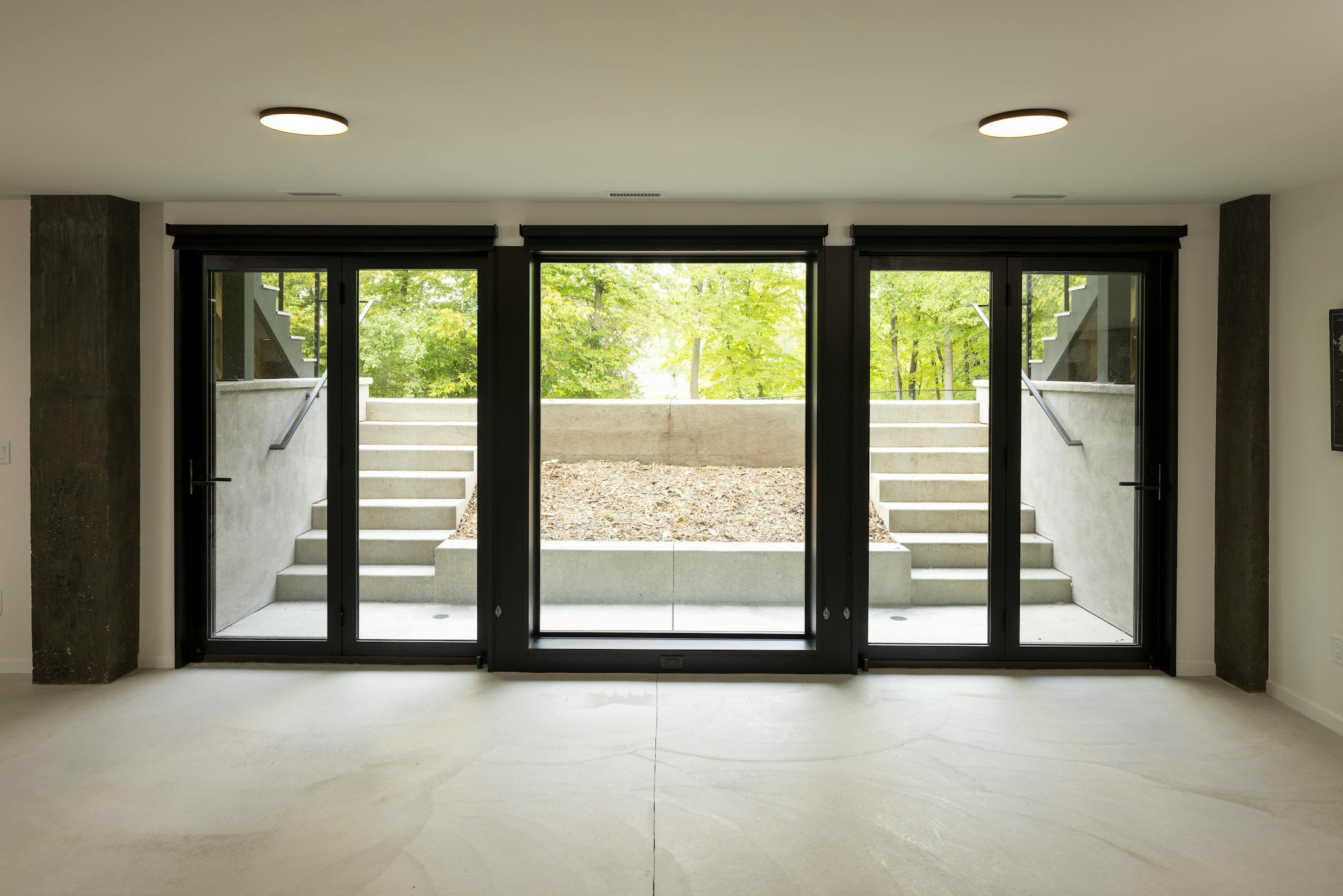 Nestled in the prairie on a gentle slope overlooking a pond, a site in Bloomington presented the perfect opportunity to build a net-zero home. The all-electric, highly insulated house with triple-pane windows, high-efficiency appliances, LED lighting, solar-paneled roof and geothermal heat pump system produces as much electricity as it consumes. Cedar accents and black corrugated metal help define the home’s elegance, as does a dream kitchen, two-story living and dining space as well as screened porches that maximize outdoor views.
