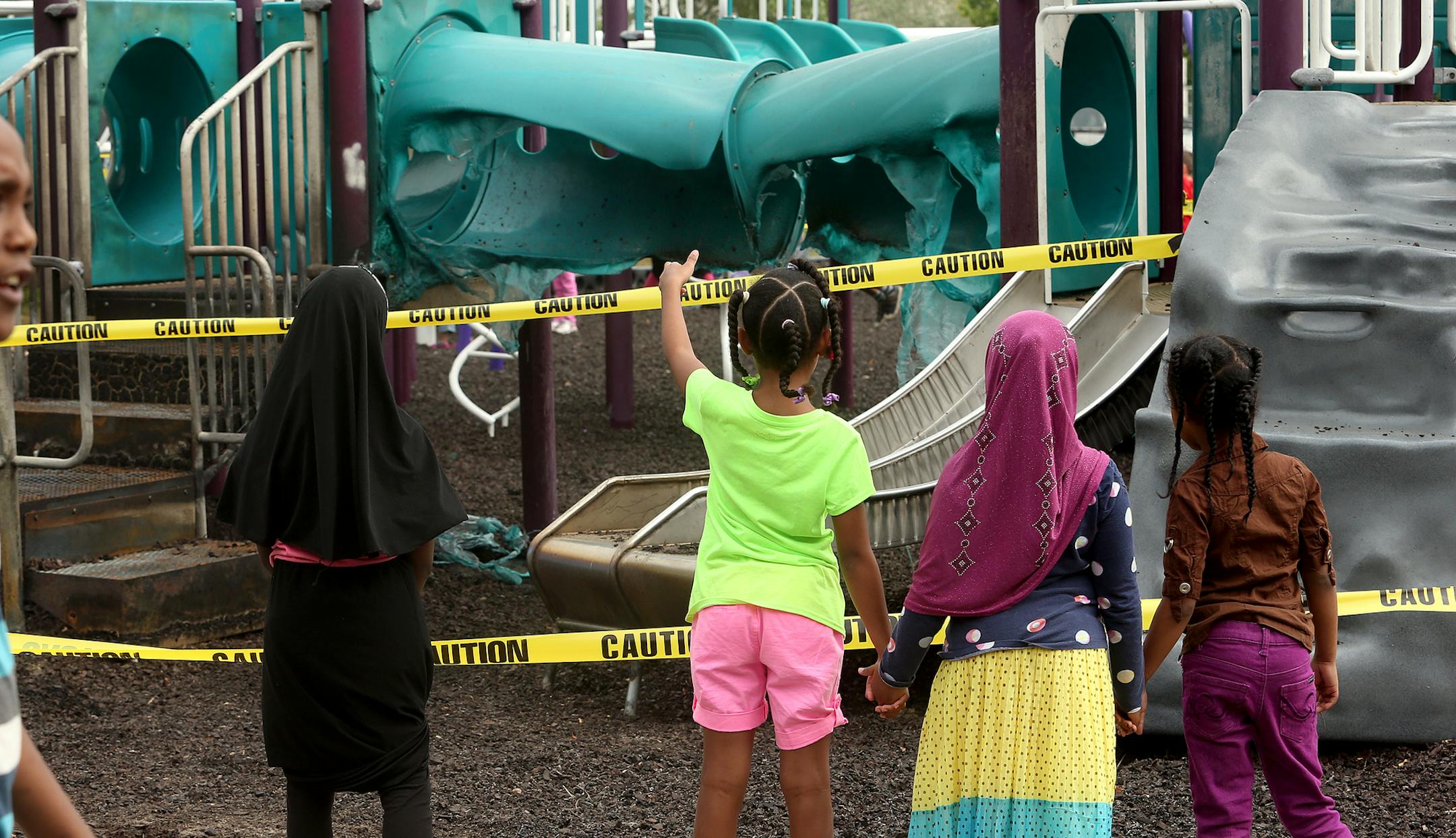 Four Lyndale Elementary School students looked at the damage caused on the playground by arsons at Lyndale Elementary School at 312 West 34th St. in Minneapolis, MN. September 09, 2013. ] JOELKOYAMA‚Ä¢joel koyama@startribune A fifth act of arson is being blamed for the latest torching of a Minneapollis public school playground, this one occurring over the weekend at Lyndale School.