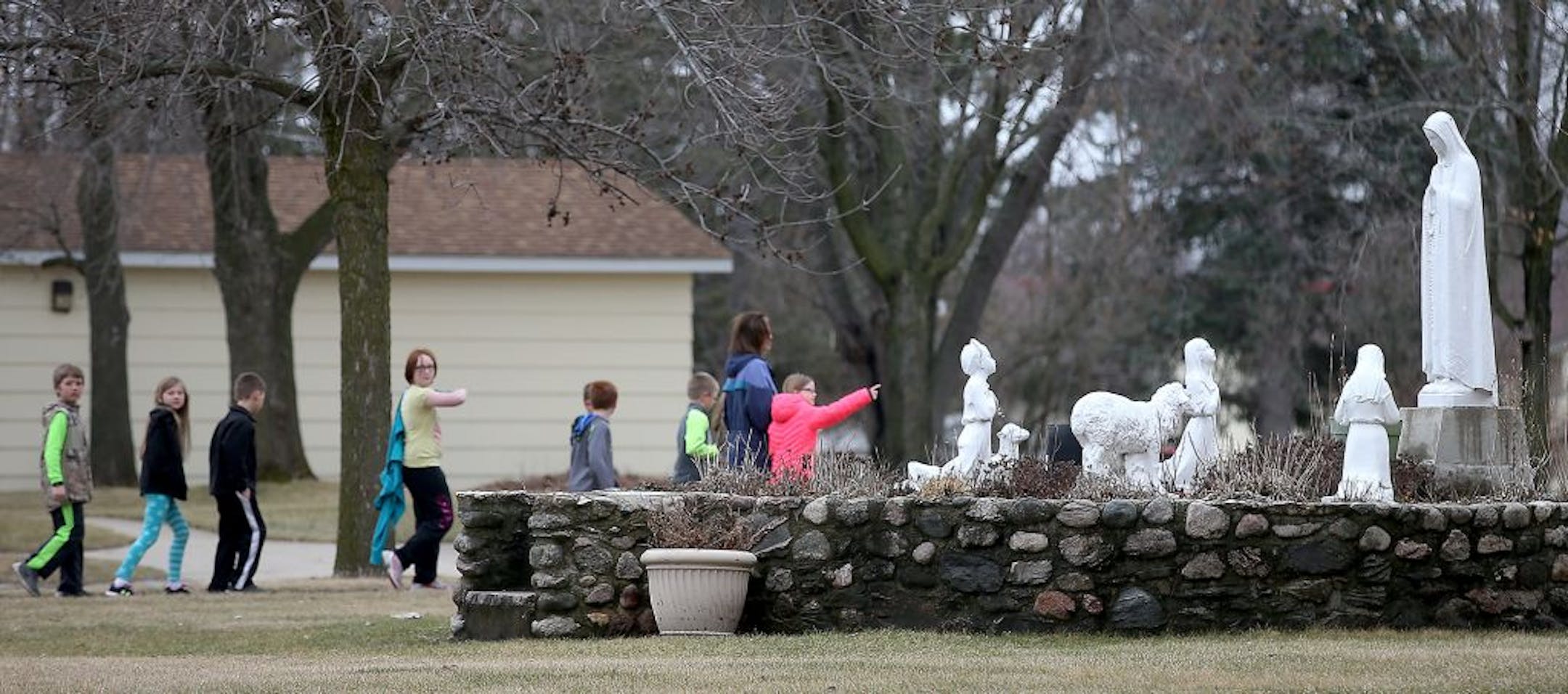 St. Mary's Catholic school children took a walk to take a look at the fire damage to the 120-year-old St. Mary's Catholic Church, Monday, March 14, 2016 in Melrose, MN.