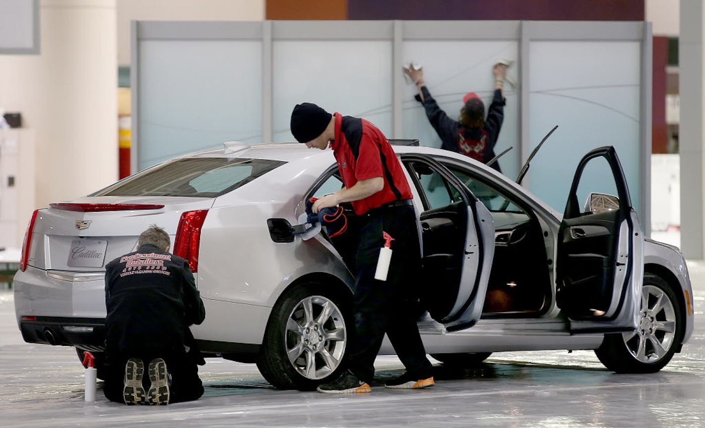 Dealerships, including Cadillac, set up for the annual Minneapolis auto show, Friday, March 6, 2015 in Minneapolis, MN. The show starts Saturday at the Minneapolis Convention Center. ] (ELIZABETH FLORES/STAR TRIBUNE) ELIZABETH FLORES &#x2022; eflores@startribune.com