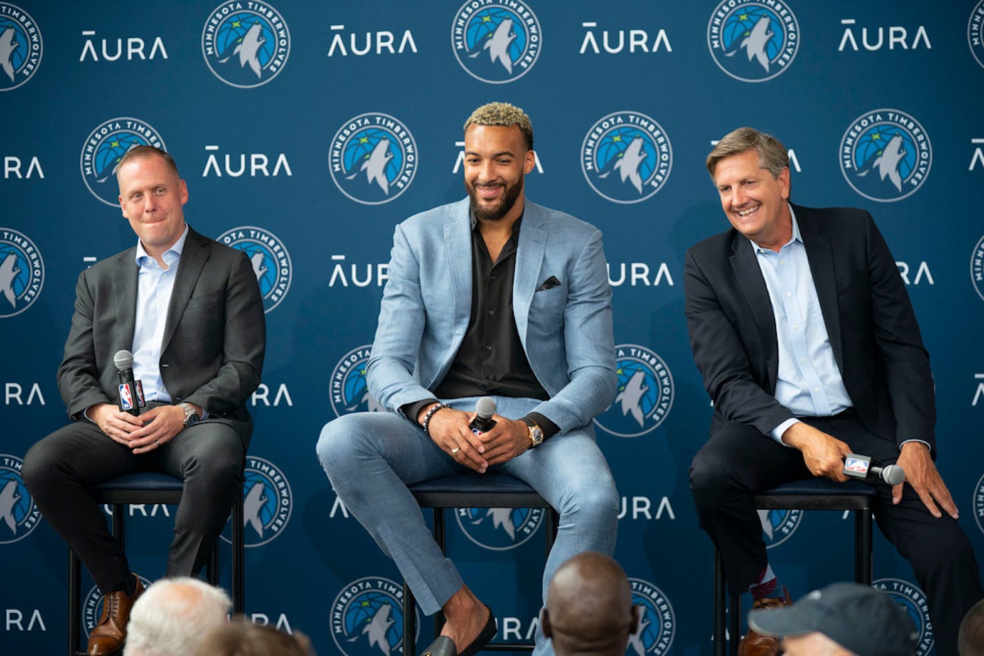 New Minnesota Timberwolves center Rudy Gobert makes general manager Tim Connelly, left, and head coach Chris Finch, right, laugh at a press conference introducing Gobert as the newest member of the team Wednesday, July 6, 2022 at Target Center in Minneapolis.    ]