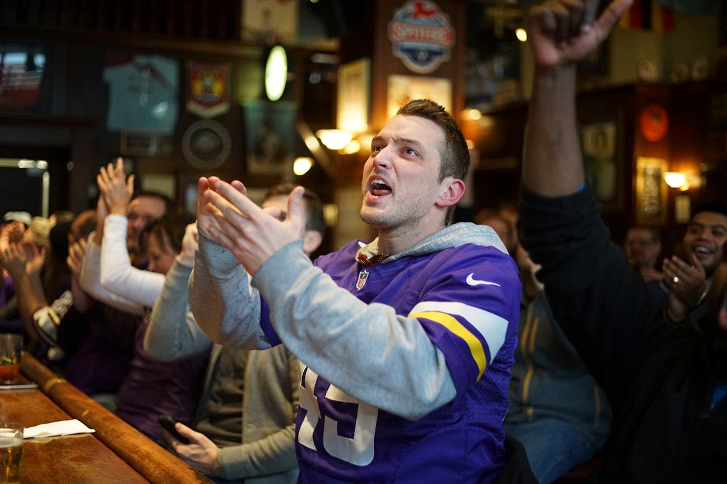 Braden Eichten of St. Paul cheered on the Vikings as they scored a touchdown. ]Vikings fans watch their team take on the Cleveland Browns on the televisions at Brit's Pub.Richard Tsong-Taatarii/Richard.tsong-taatarii@startribune.com