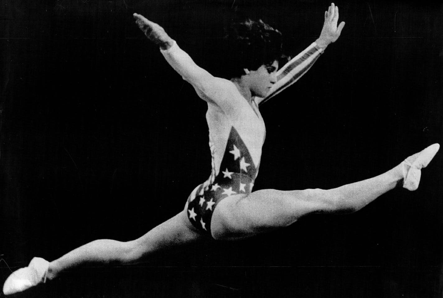 August 3, 1984 Los Angeles: Like a star-spangled bird in flight, soaring high above the balance beam 8/3, Mary Lou Retton wins the gold medal in gymnastics. Larry Rubenstein, United Press International