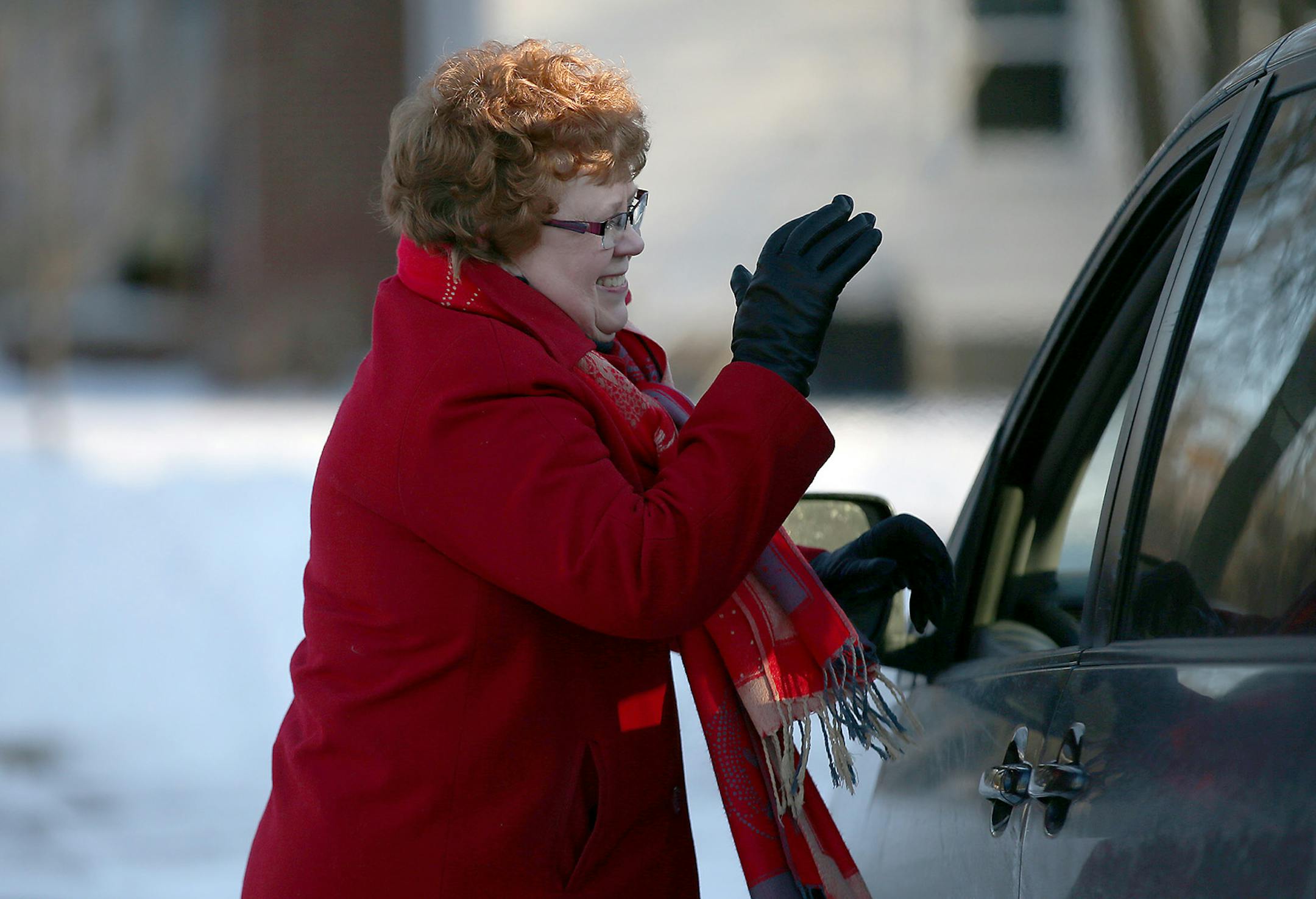 Church Outreach Minister Karen Walhot waved goodbye to a passenger after praying with her in the Lutheran Church of the Good Shepherd parking lot, Wednesday, March 4, 2015 in Minneapolis, MN. T ] (ELIZABETH FLORES/STAR TRIBUNE) ELIZABETH FLORES • eflores@startribune.com