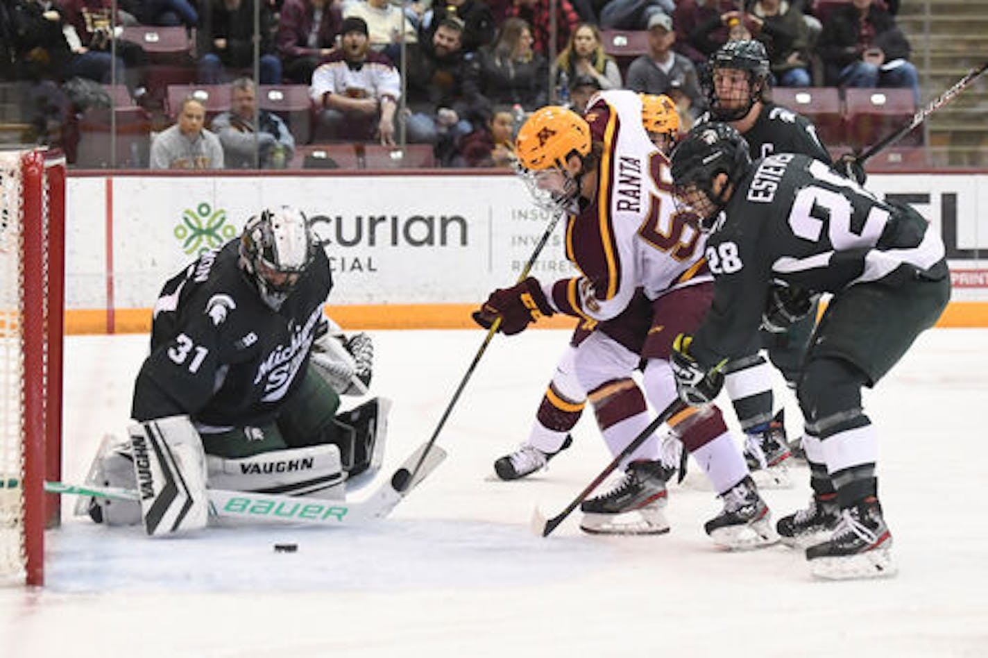 Minnesota Gophers forward Sampo Ranta (58) scored a goal on Michigan State goaltender John Lethemon (31) in the second period.