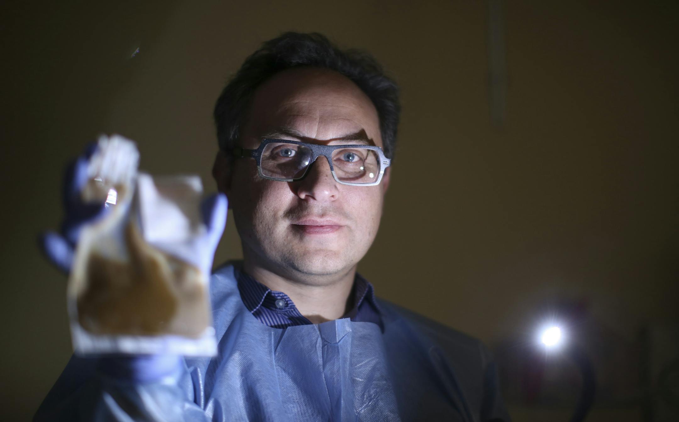 Dr. Alex Khoruts, the gastroenterologist who is principal investigator, was photographed holding a dose of donor microbiota in a colonoscopy suite at the University of Minnesota Medical Center Tuesday afternoon. ] JEFF WHEELER &#x201a;&#xc4;&#xa2; jeff.wheeler@startribune.com Scientists at the U of M are trying to figure out if they can alter the way glucose is metabolized by diabetic and obese patients by salting their bowels with organisms donated by lean people. Dr. Alex Khoruts, the gastroen