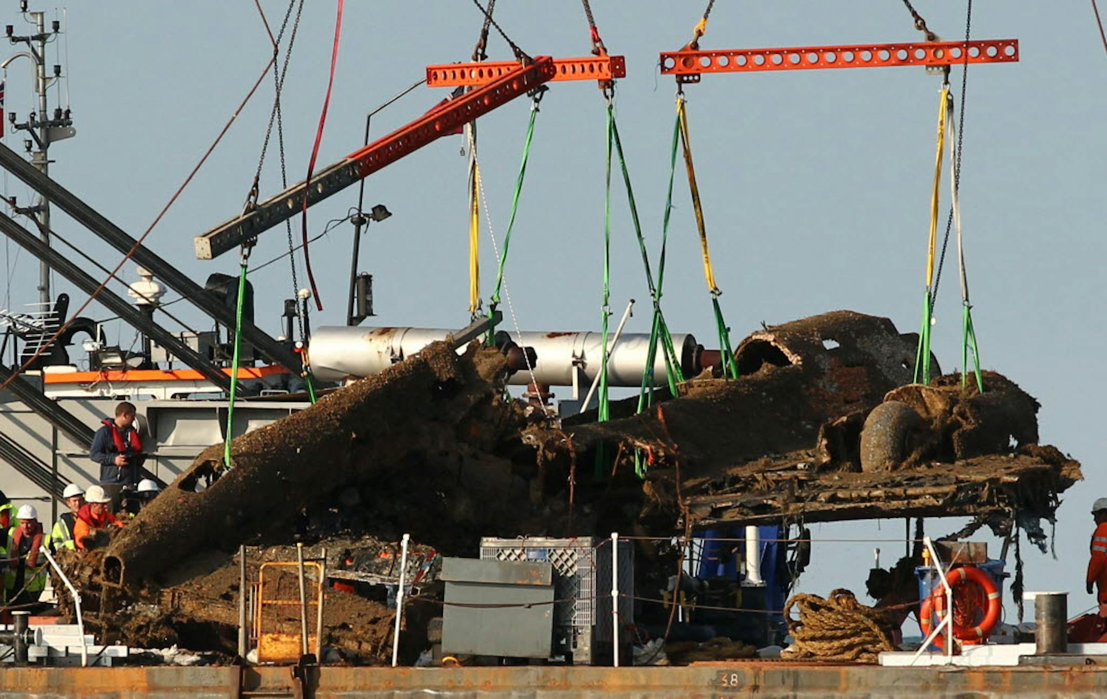 Lifting equipment raises a World War II Dornier bomber from the English Channel off Deal, southern England, Monday.
