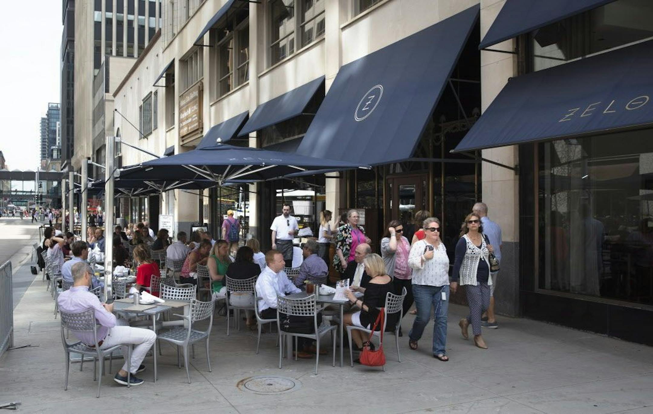 Nicollet Mall sidewalk cafes. The biggest one is the stretch of tables outside the Local, Barrio and Randle's, between 9th and 10th. The one that's shot straight on, with the Young Quinlan building in the background, is Haskell's Wine Bar. The one with the blue awnings is Zelo. [ Sidewalks Cafe's Photos by Rick Nelson