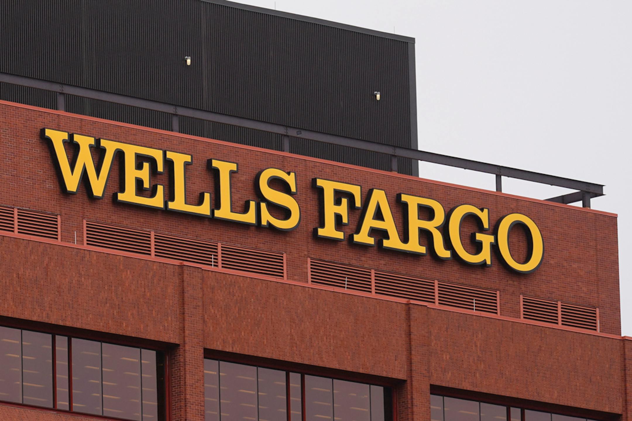 Shown is a Wells Fargo location in Philadelphia, Tuesday, Oct. 12, 2021. Wells Fargo easily beat Wall Street targets, Friday, Jan. 14, 2022, in the fourth quarter, just as interest rates appear poised to take off and further boost the nation's largest mortgage lender. (AP Photo/Matt Rourke)