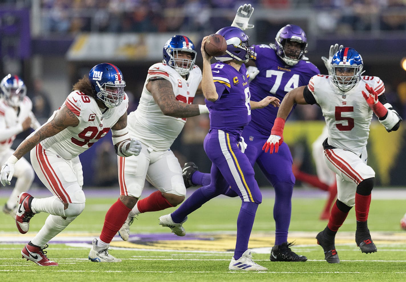 Minnesota Vikings quarterback Kirk Cousins (8) looks to break from the New York Giants defense Sunday.