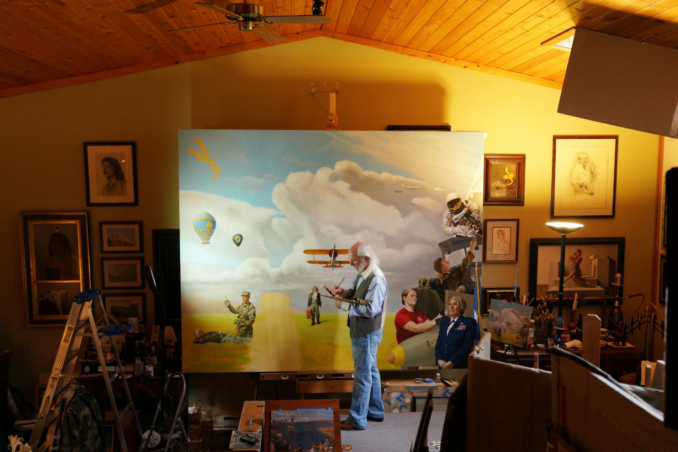 Classically trained Italian fresco painter Charles Gilbert Kapsner worked on the last of five murals for his 10-year U.S. war veterans project at his studio in Little Falls.