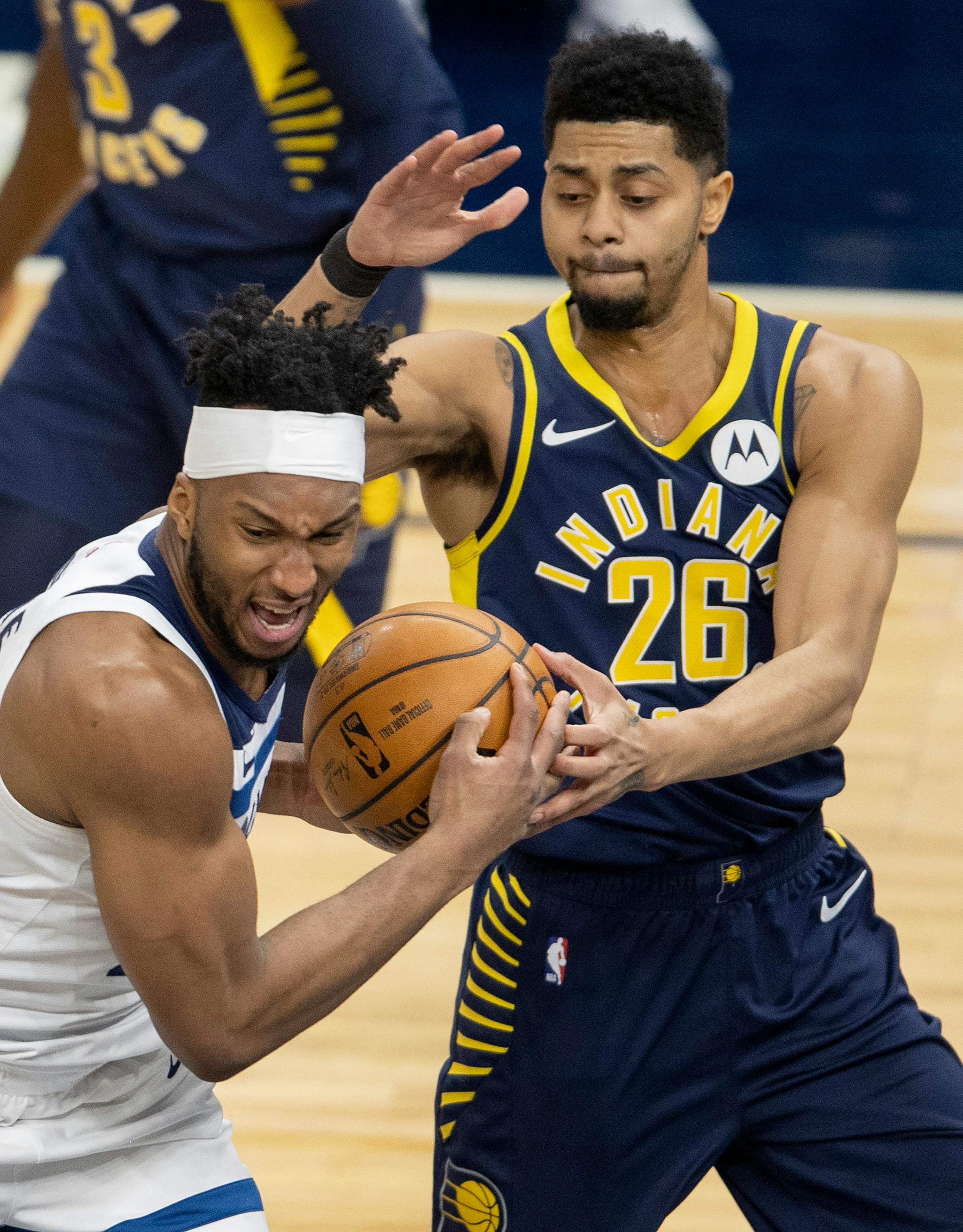 Minnesota Timberwolves Josh Okogie (20) was defended by Jeremy Lamb (26) of the Indiana Pacers in the second quarter.