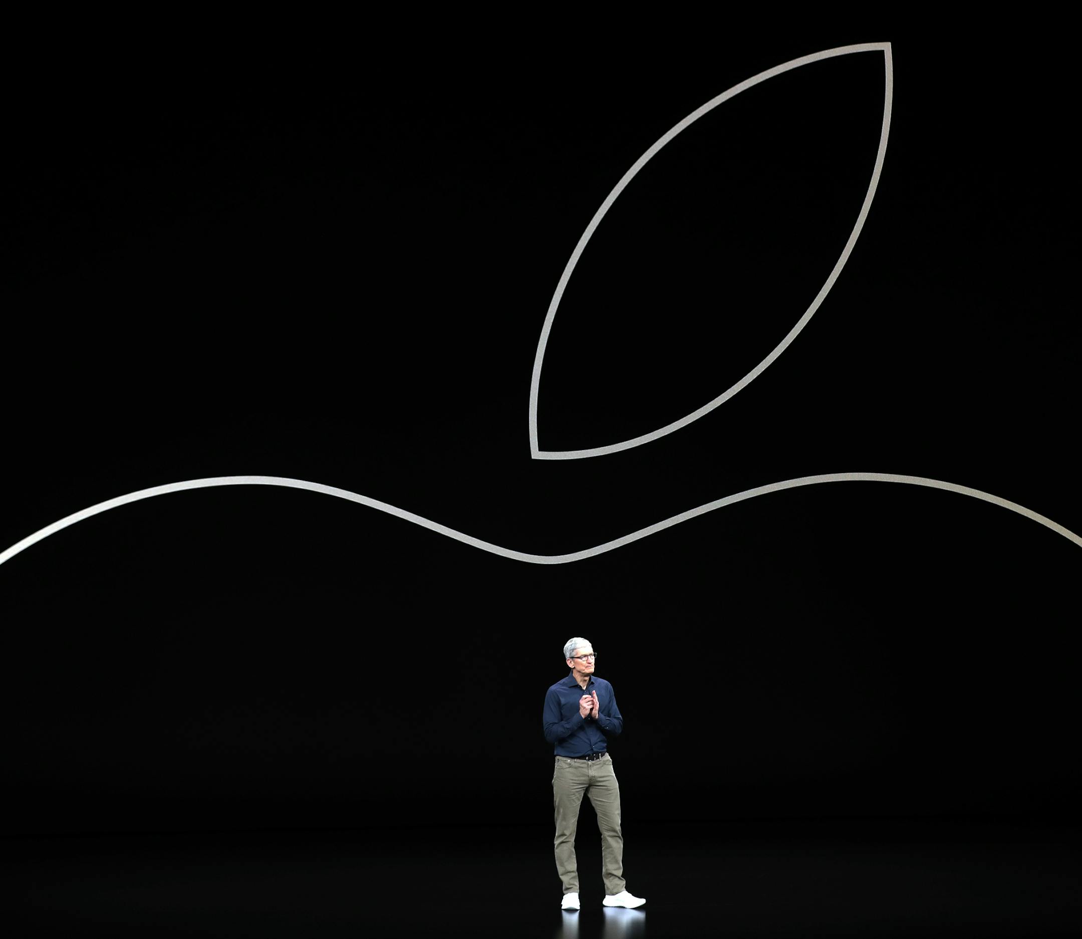 FILE- In this Sept. 12, 2018, file photo, Apple CEO Tim Cook discusses the new Apple iPhones and other products at the Steve Jobs Theater during an event to announce new products in Cupertino, Calif. Apple will build a $1 billion campus in Austin, Texas, break ground on smaller locations in Seattle, San Diego and Culver City, Calif., and over the next three years will expand in Pittsburgh, New York and Colorado. (AP Photo/Marcio Jose Sanchez, File) ORG XMIT: NYAG402