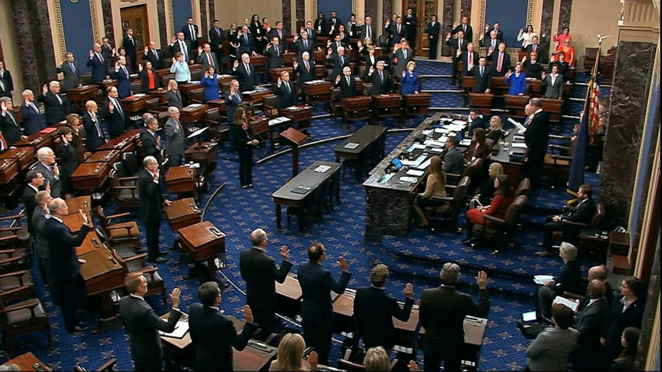 In this Jan. 16, 2020, image from video, presiding officer Supreme Court Chief Justice John Roberts swears in members of the Senate for the impeachment trial against President Donald Trump at the U.S. Capitol in Washington.