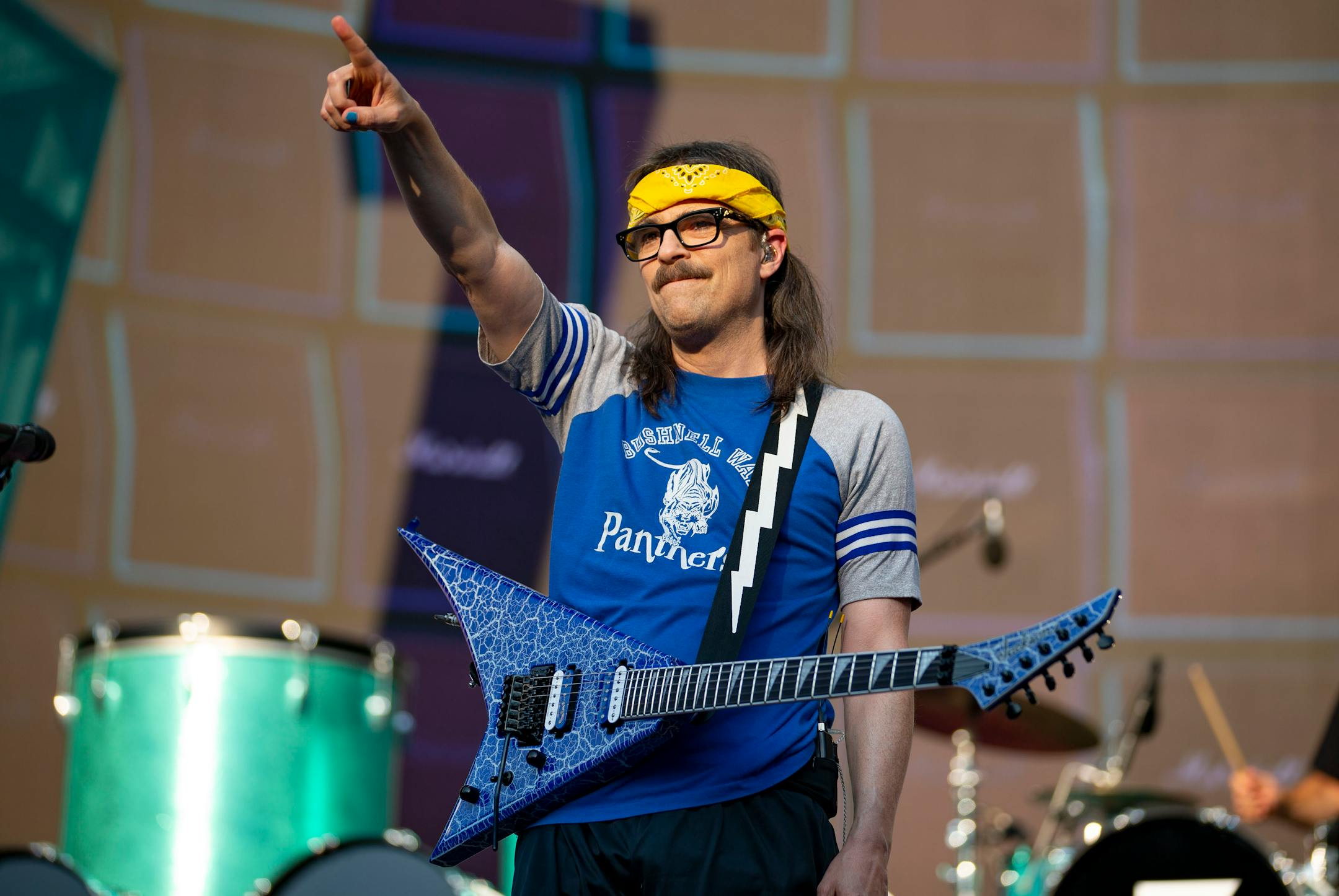 Rivers Cuomo, lead singer of Weezer, pointed at the crowd during the band's set at Target Field as part of the Hella Mega Tour on Monday evening.