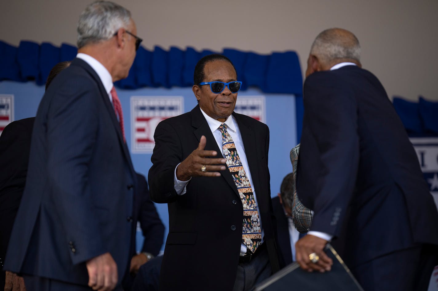 Twins legend Rod Carew reached to hug his former teammate and road roommate, Tony Oliva, after he delivered his acceptance speech during the Hall of Fame Induction Ceremony Sunday, July 24, 2022 on the grounds of the Clark Sports Center in Cooperstown, New York. ] JEFF WHEELER • Jeff.Wheeler@startribune.com