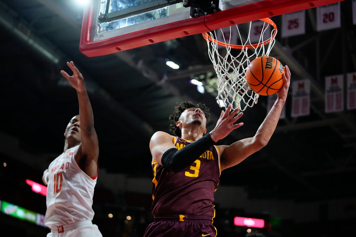 Minnesota forward Dawson Garcia (3) goe3s up for a shot against Maryland forward Julian Reese (10) during the first half of an NCAA college basketball game, Wednesday, Feb. 22, 2023, in College Park, Md. (AP Photo/Julio Cortez)