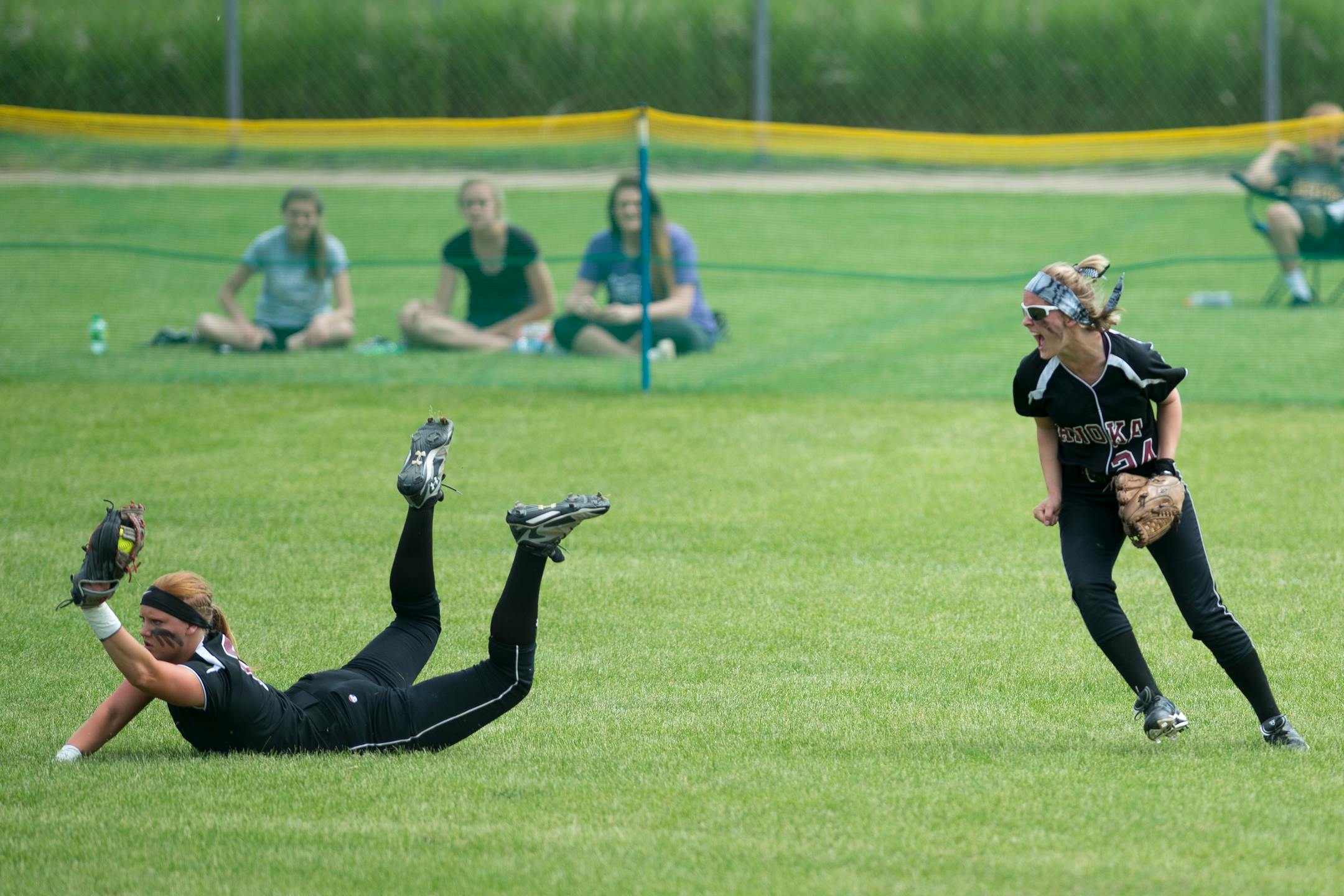 Anoka outfielder Taylor Chell (left, with Gabby Blomlie closing in) made a diving catch against Eastview in the Class 3A softball title game in 2015.