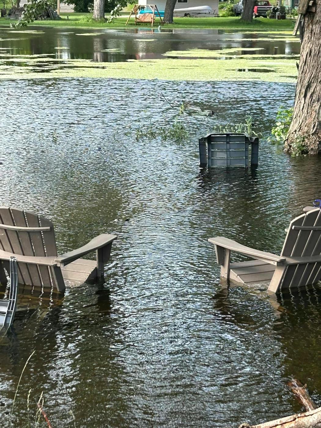 Floodwaters outside Bryan and Robin McMullen's cabin in Waterville, Minn.