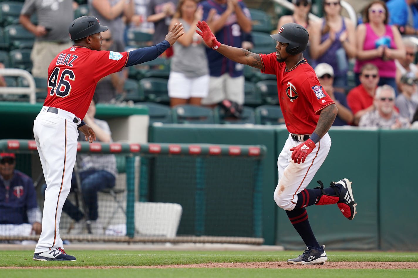 Twins center fielder Byron Buxton was congratulated by third base coach Tony Diaz after hitting a two-run home run. Buxton is in line for a reboot this season.