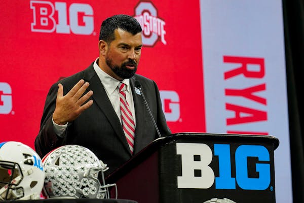 Ohio State head coach Ryan Day talks to reporters during an NCAA college football news conference at the Big Ten Conference media days, at Lucas Oil S