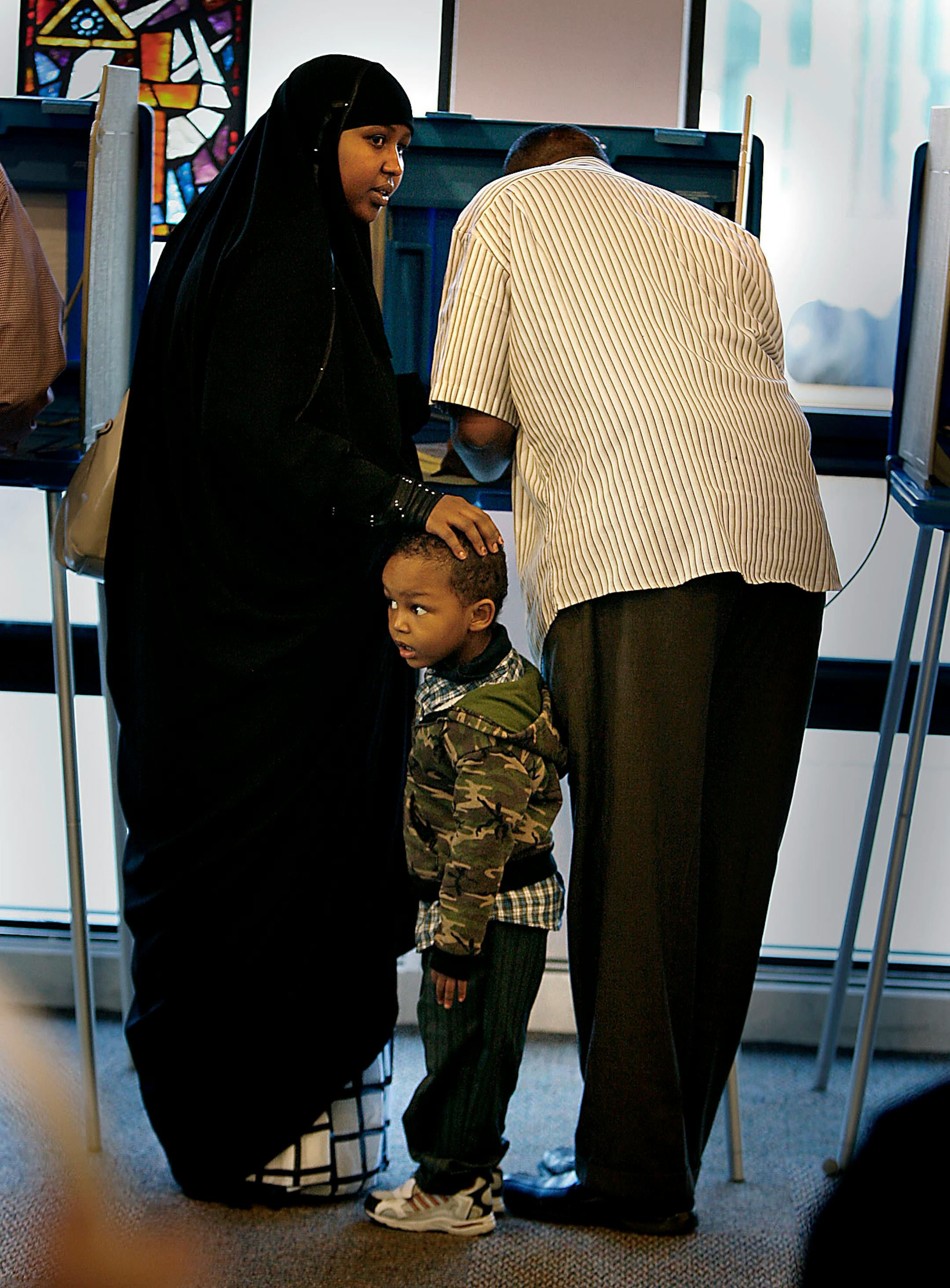 Three-year-old Hamsa Ali got his first taste of the Democratic process as he went with his parents Shamso Tahlil and Mohamed Ali to cast their vote Tuesday at Central Lutheran Chuch. Shamso Tahlil said it was their first time to vote.