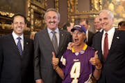 Vikings fan Larry Spooner, who attended countless legislative hearings on the stadium posed with Governor Dayton and Mark and Zygi Wilf at a private r