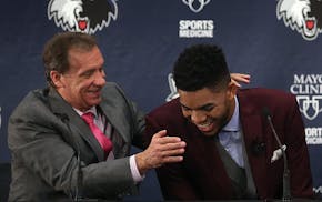 June 2015: No. 1 pick Karl-Anthony Towns shares a laugh with the man who chose him: then-head coach Flip Saunders.