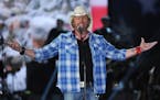 FILE - In this April 7, 2014, file photo shows Toby Keith performs at ACM Presents an All-Star Salute to the Troops in Las Vegas. Singer and songwrite