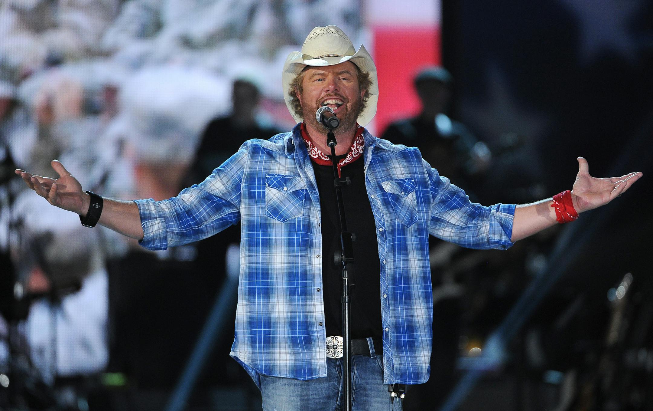FILE - In this April 7, 2014, file photo shows Toby Keith performs at ACM Presents an All-Star Salute to the Troops in Las Vegas. Singer and songwriter Keith will perform a tribute to the late legend Merle Haggard during the American Country Countdown Awards on May 1, 2016. (Photo by Chris Pizzello/Invision/AP, File)