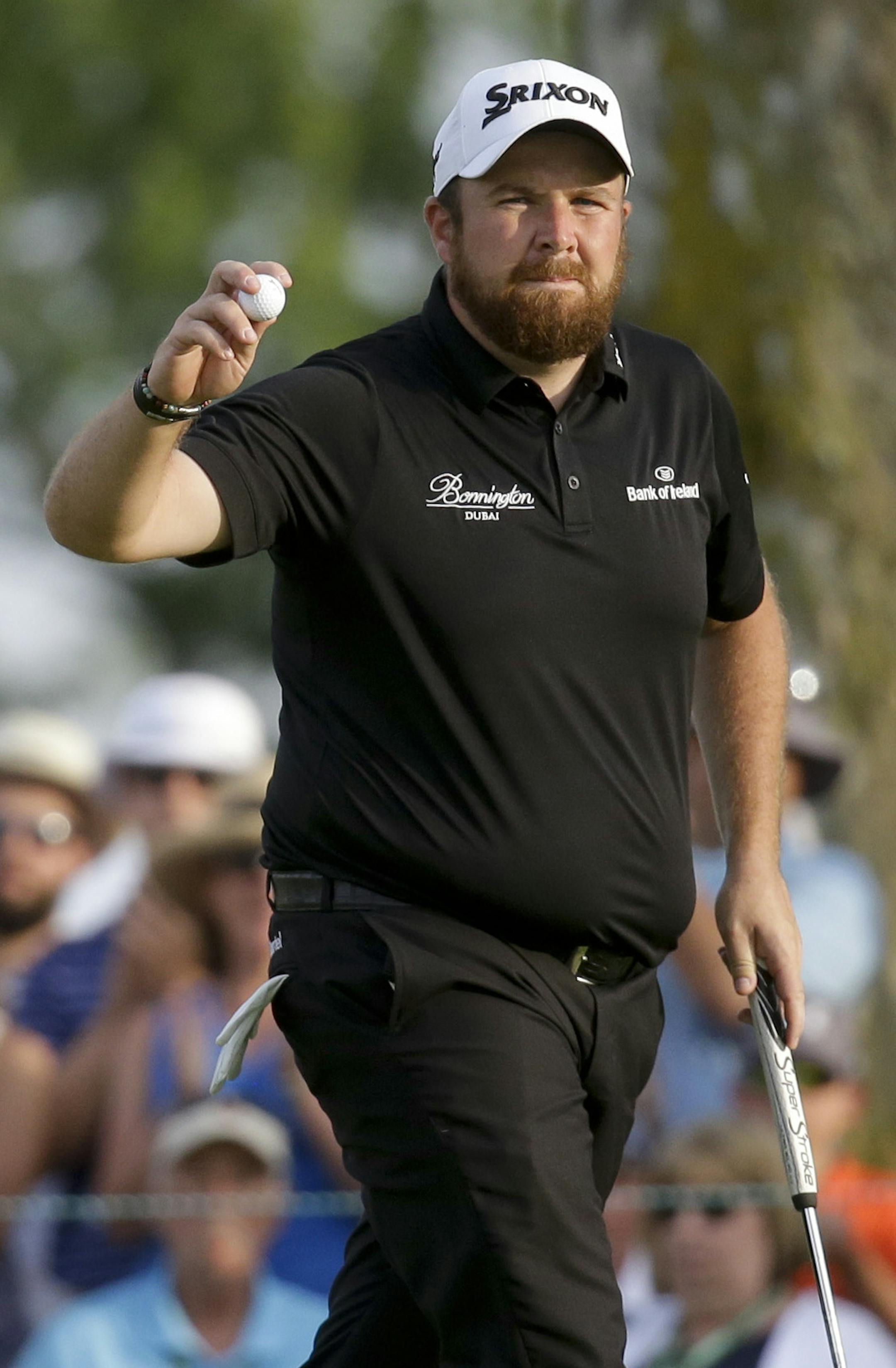 Shane Lowry, of Republic of Ireland, waves after making a putt on the ninth hole during third round of the U.S. Open golf championship at Oakmont Country Club on Saturday, June 18, 2016, in Oakmont, Pa. (AP Photo/John Minchillo)
