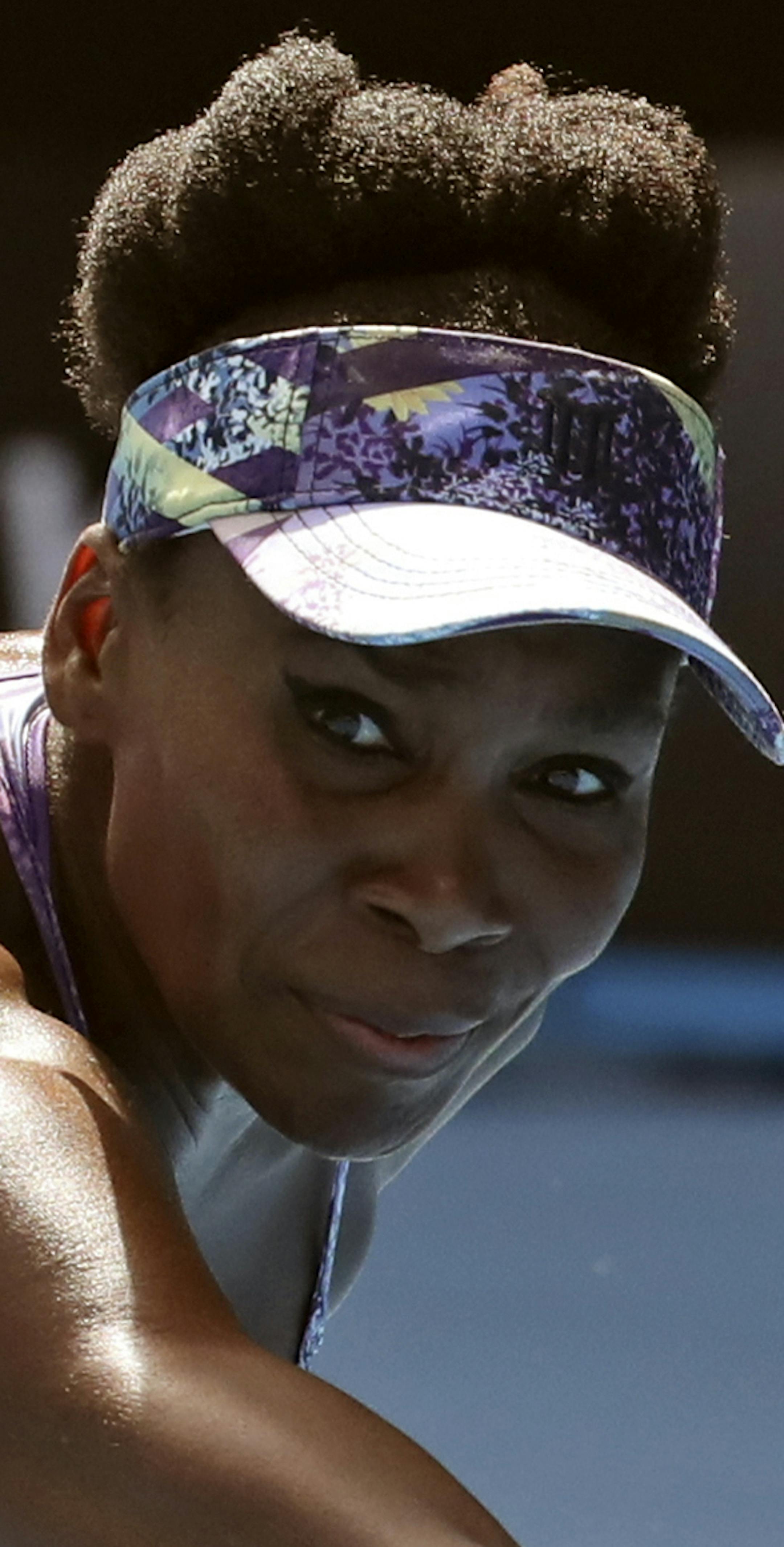 United States' Venus Williams makes a backhand return to compatriot Coco Vandeweghe during their semifinal at the Australian Open tennis championships in Melbourne, Australia, Thursday, Jan. 26, 2017. (AP Photo/Aaron Favila)