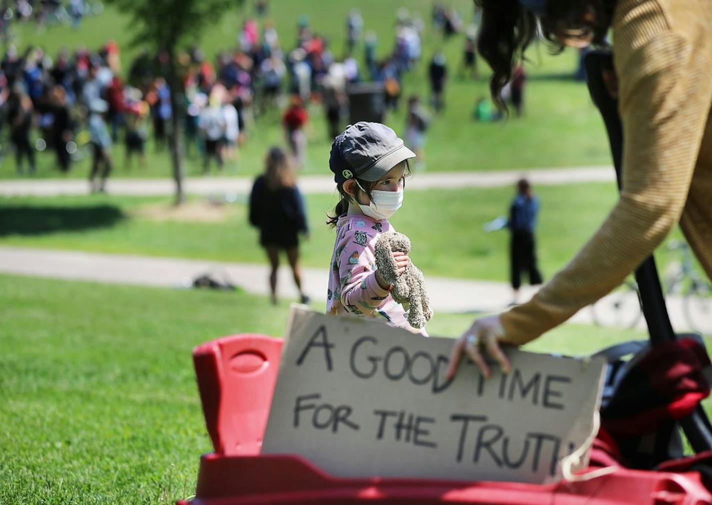 Powderhorn Park neighbors gathered Saturday morning in the park to make plans to collectively protect their blocks and homes for what may be coming in future days of unrest and rioting. Here, neighbor Margot Silver and her daughter Oona, 3 1/2, who bought her stuffed bunny, came out for the event in the wake of the death of George Floyd while in police custody earlier in the week and seen Saturday, May 30, 2020, in Minneapolis, MN.