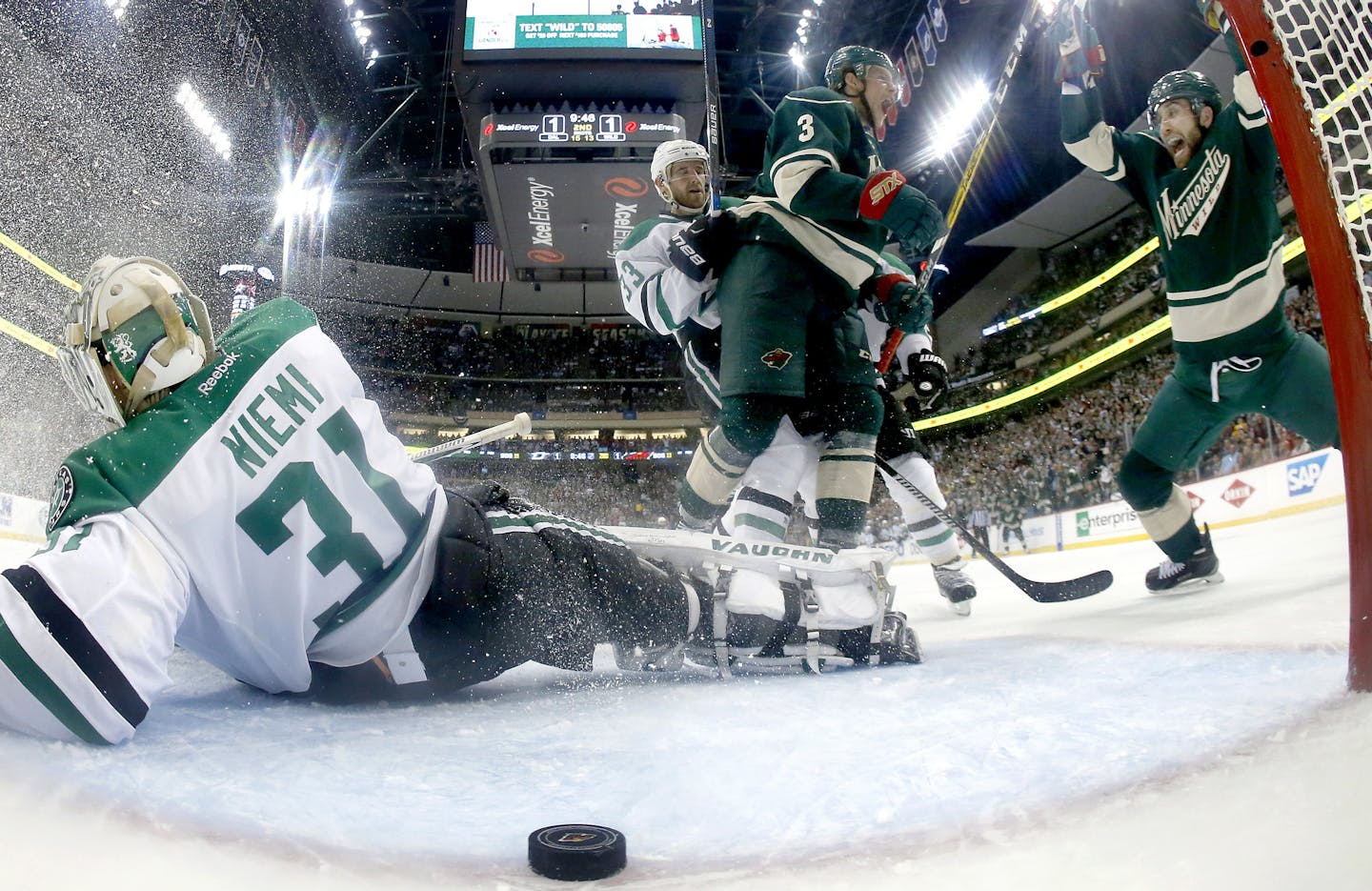 Charlie Coyle (3) and Jason Zucker (16) celebrated after Coyle scored a goal in the second period. ] CARLOS GONZALEZ cgonzalez@startribune.com - April 20, 2016, St. Paul, MN, Xcel Energy Center, NHL, Hockey, Minnesota Wild vs. Dallas Stars, First Round Stanley Cup Playoffs, Game 4