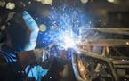 A worker welds the frame for the 2016 Wildcat X side-by-side vehicle at the Arctic Cat factory in Thief River Falls, Minn., on Sept. 30, 2015. (Leila 
