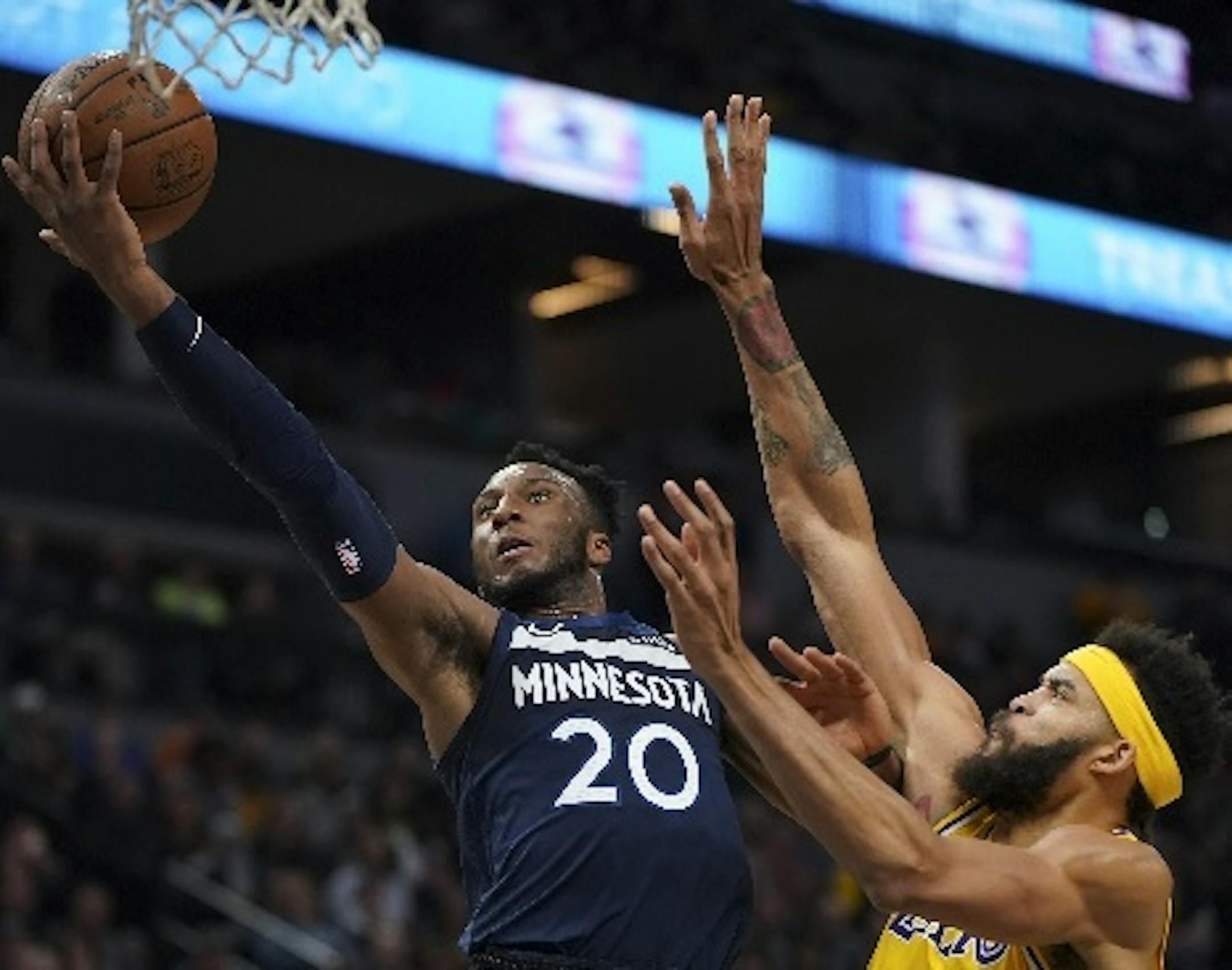 Timberwolves guard Josh Okogie took a first-quarter shot as Lakers center JaVale McGee defended in Minnesota's 124-120 victory at Target Center on Monday night.