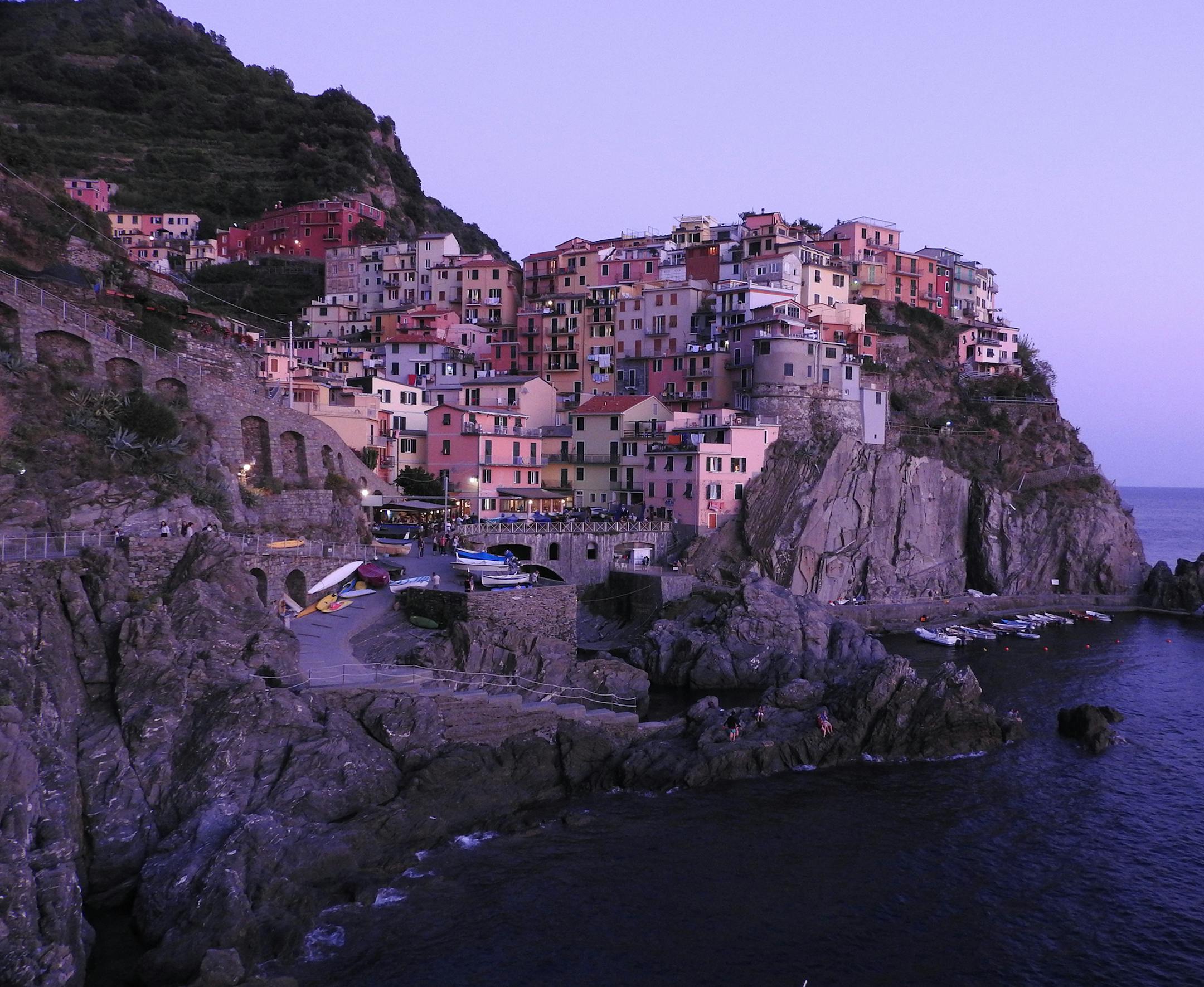 Hi Kerri, Name: Diane Burns-Faribault, MN
Phone: 507-334-8617
Picture of Manarola, Italy My husband and I visited the five villages of the Cinque Terre area in Italy. The one thing that I wanted to accomplish before we left, was to be in Manarola during the evening. To get this shot, we walked the trail up the hillside, and found a place among all of the other people with the same idea. The opportunity to meet people from many different countries made the wait for dusk more enjoyable. I took thi