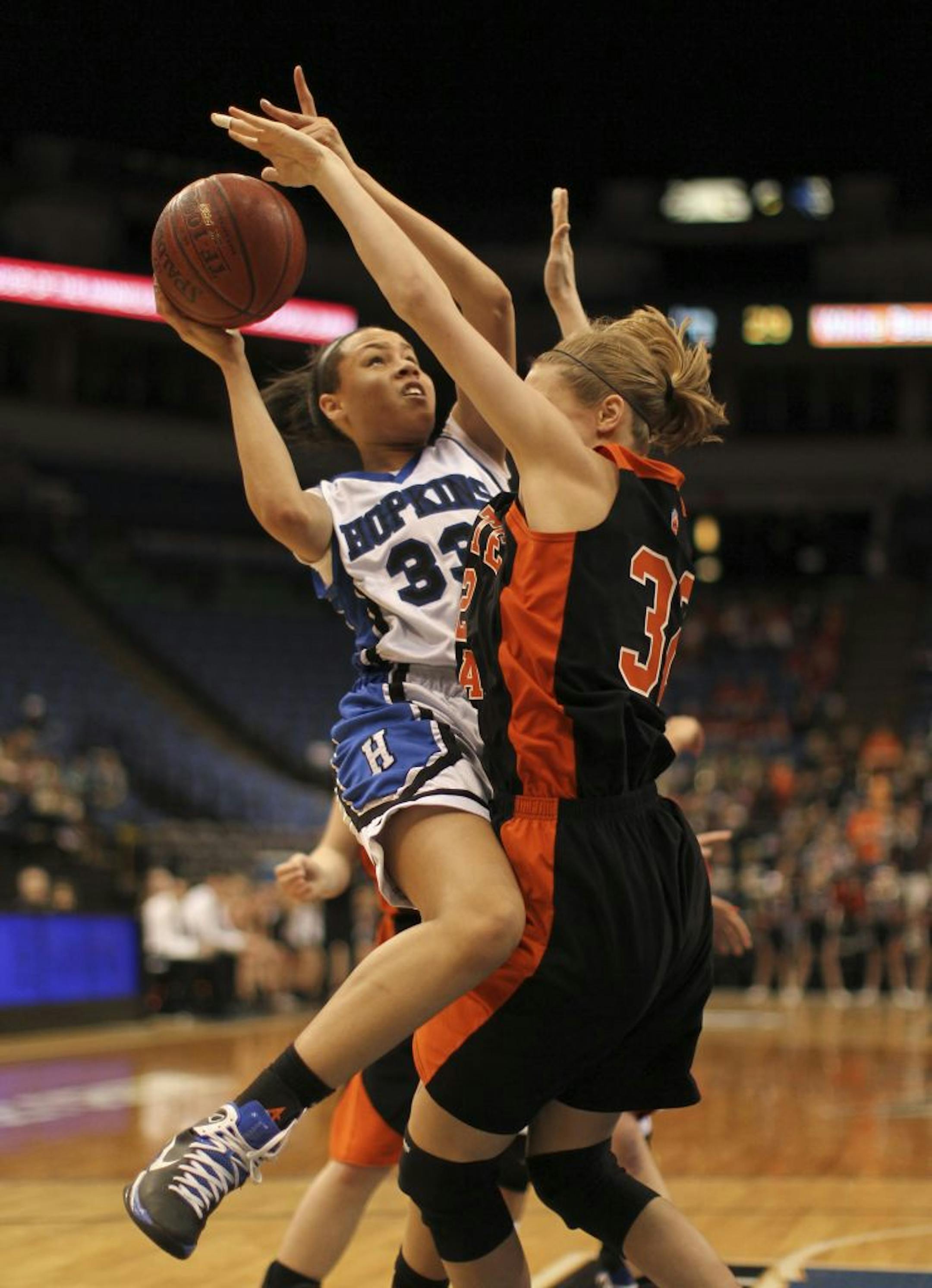 The Royals' Sydney Coffey slammed into the defense of White Bear Lake's Danielle Renner.