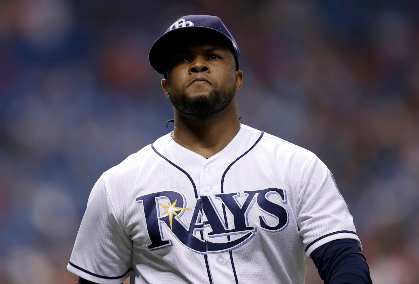 Tampa Bay Rays relief pitcher Alex Colome leaves the field after allowing the go-ahead run by the Philadelphia Phillies during the ninth inning of a baseball game Friday, April 13, 2018, in St. Petersburg, Fla. (AP Photo/Chris O'Meara)