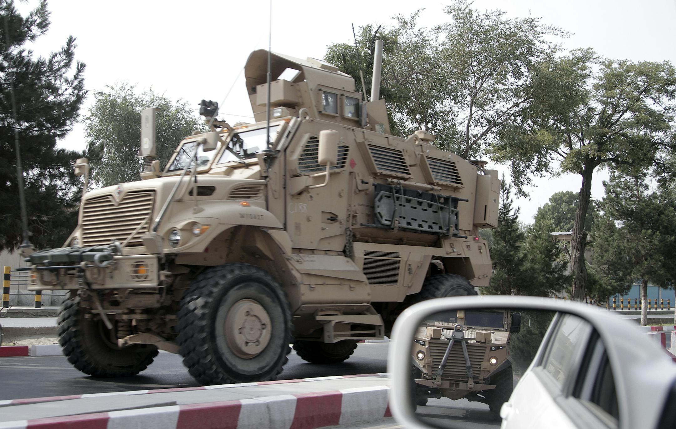 A U.S. armored vehicle patrols in Kabul, Afghanistan, Wednesday, Aug. 23, 2017. In a national address Monday night, U.S. President Donald Trump reversed his past calls for a speedy exit and recommitted the United States to the 16-year-old conflict, saying U.S. troops must "fight to win." (AP Photo/Rahmat Gul) ORG XMIT: XRG102