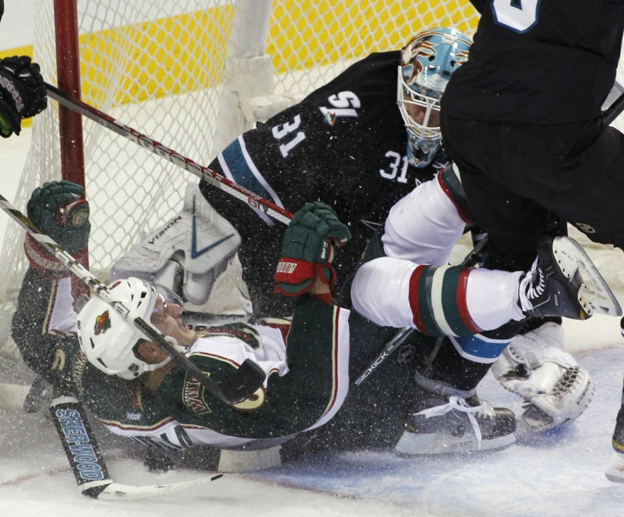 Minnesota's Marco Scandella, left, collides with San Jose goalie Antti Niemi on Nov. 10.